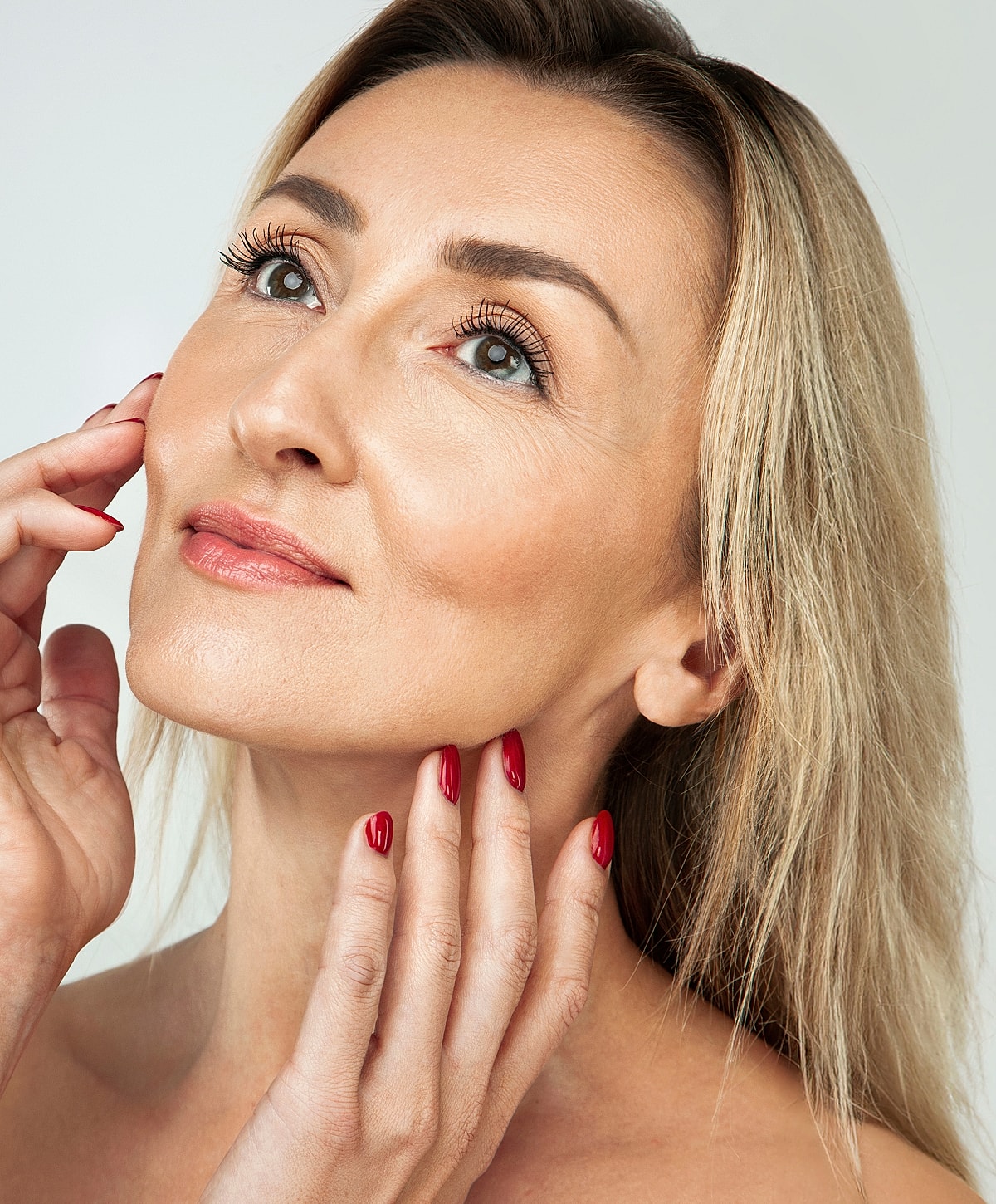 White bra on model against light background.