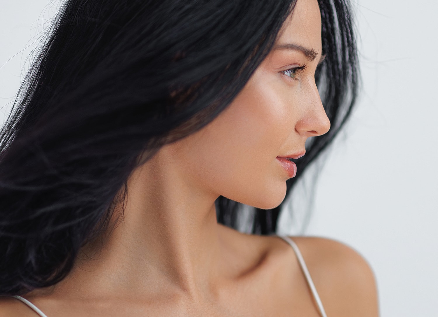Profile of a woman with long dark hair.