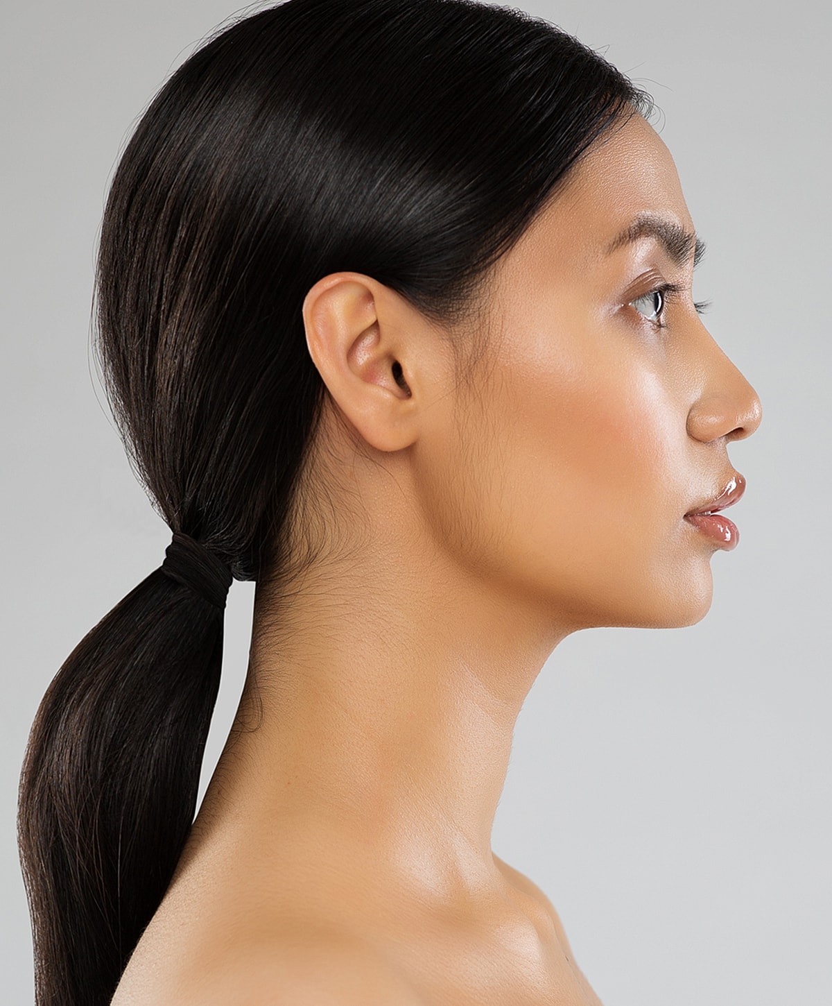 Profile view of a woman with long hair.