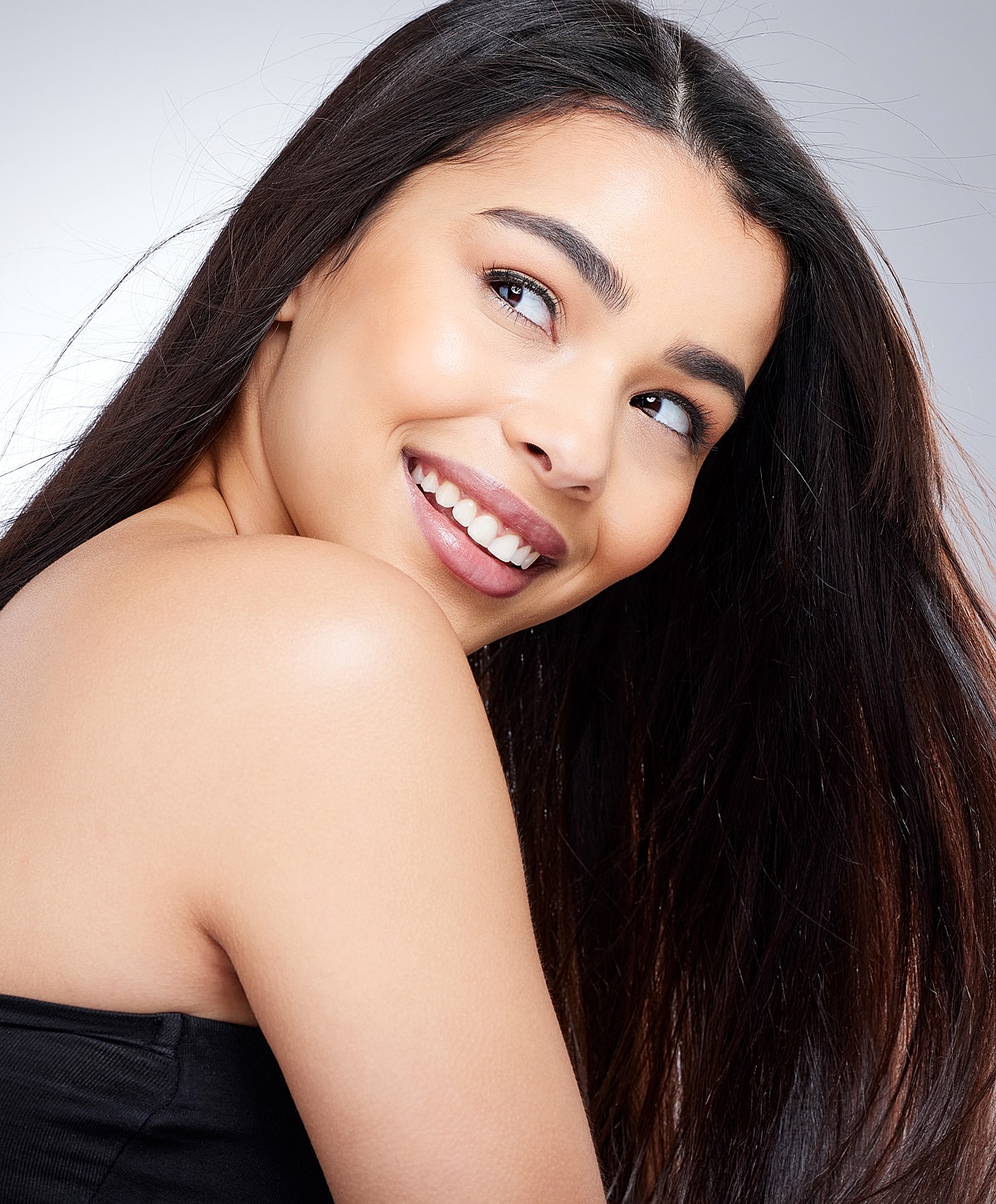 Two women engaging in conversation indoors.