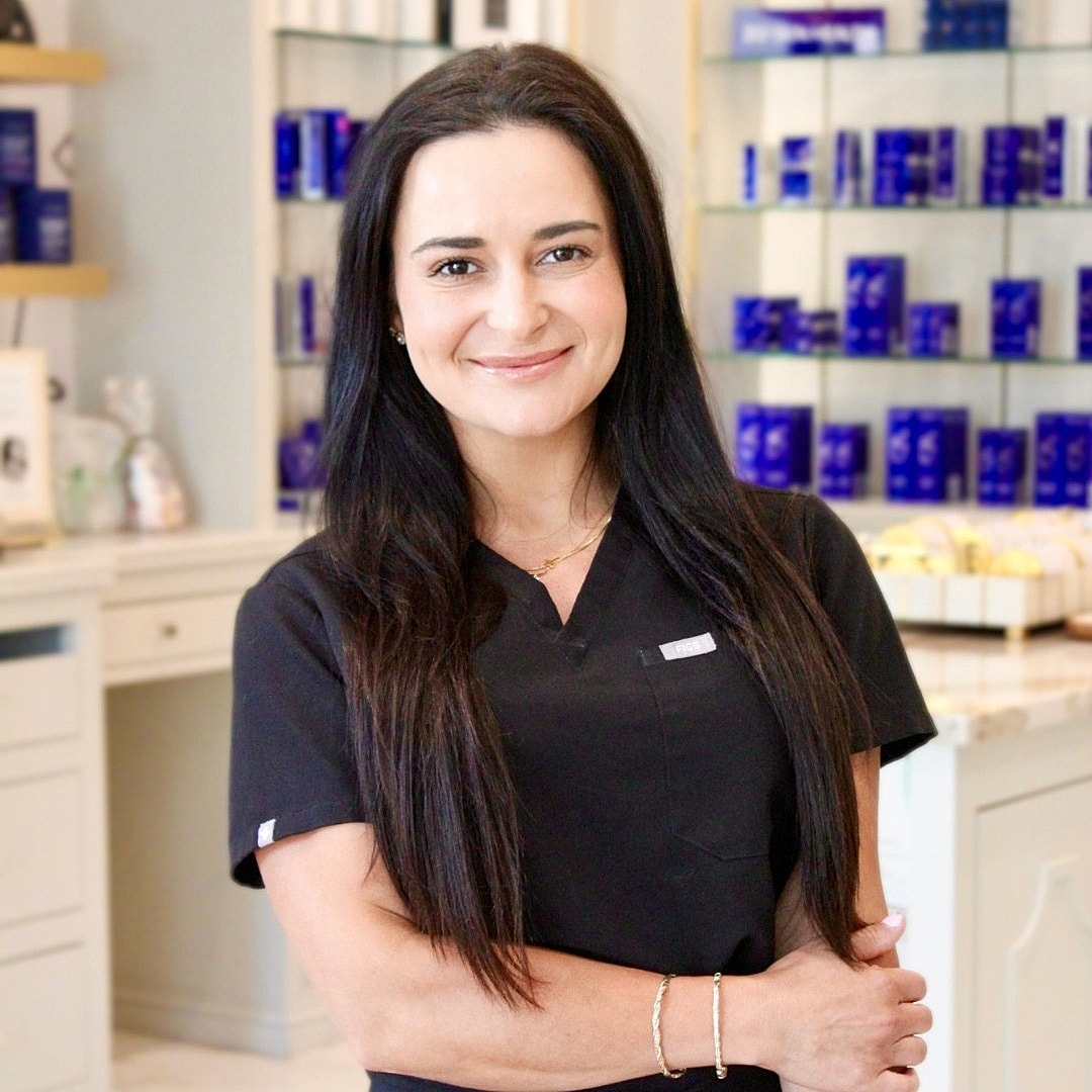 Beauty professional in a clinic setting.
