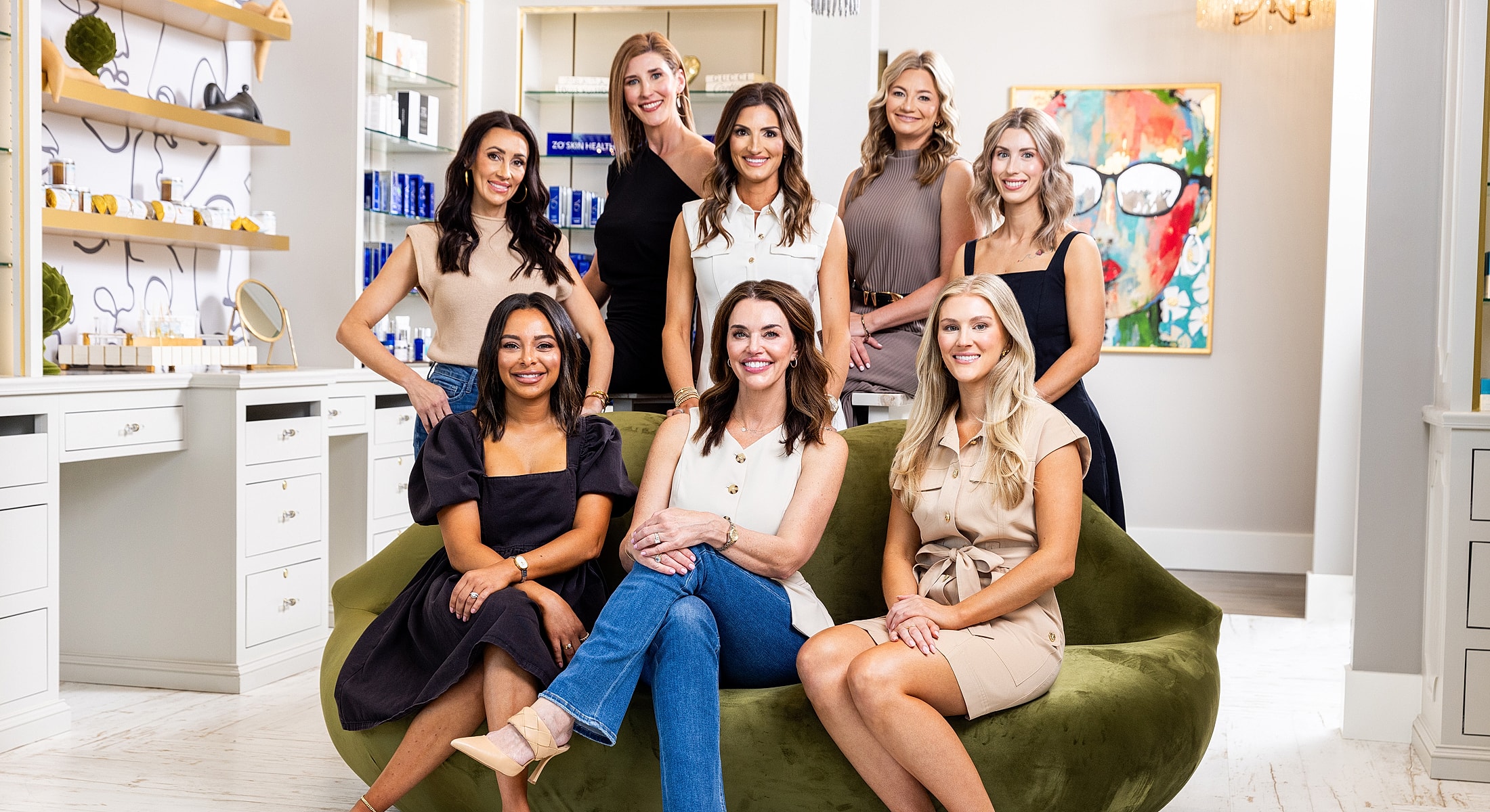 Group of smiling women in a stylish office.