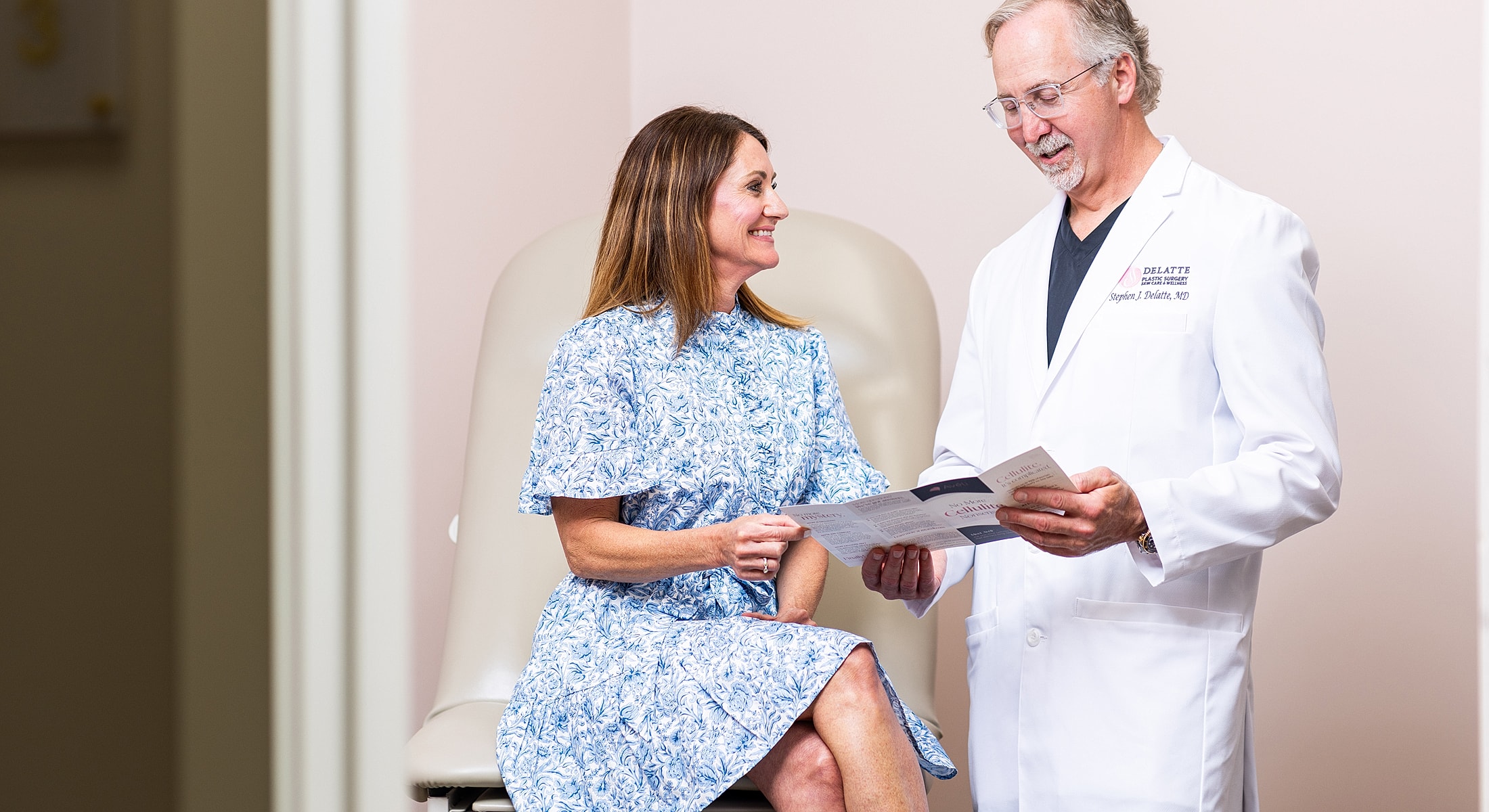 Group of women posing together, smiling indoors.