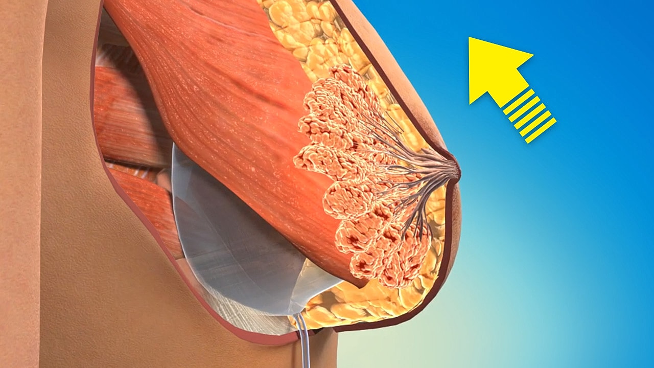 Woman in blue swimwear facing a wall.